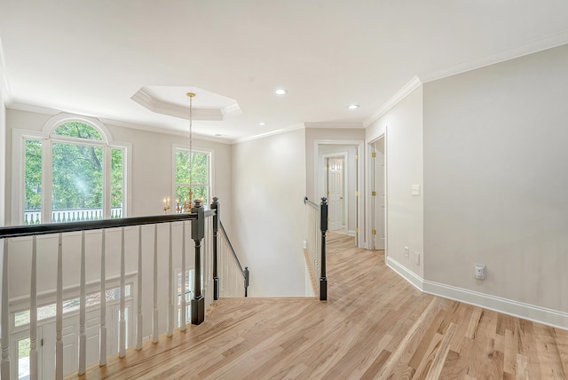 hall with a chandelier, recessed lighting, an upstairs landing, light wood-style flooring, and crown molding