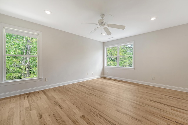 unfurnished room with visible vents, baseboards, ceiling fan, light wood-type flooring, and recessed lighting