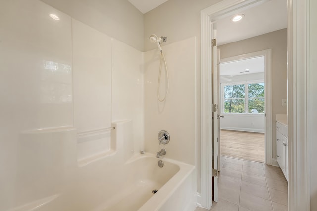 full bathroom featuring vanity, baseboards, recessed lighting, tile patterned floors, and shower / tub combination