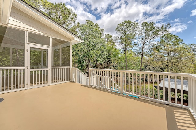 view of patio with a sunroom