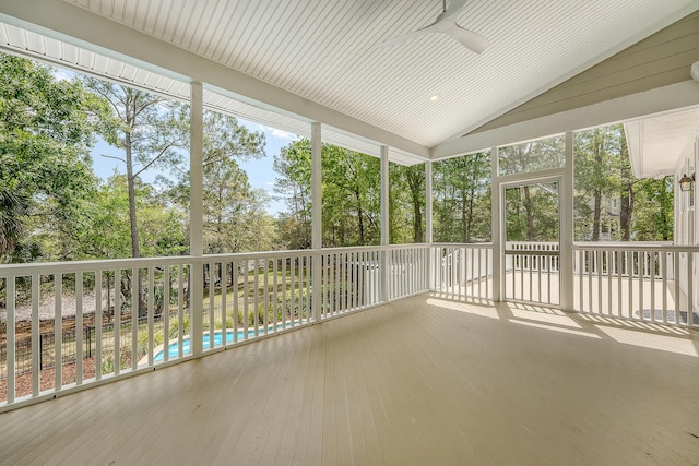 unfurnished sunroom with a ceiling fan