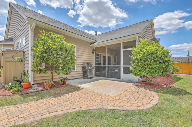 405 Decatur Dr, Summerville, SC 29486 - rear view of house with fence, a lawn, a patio, and a sunroom