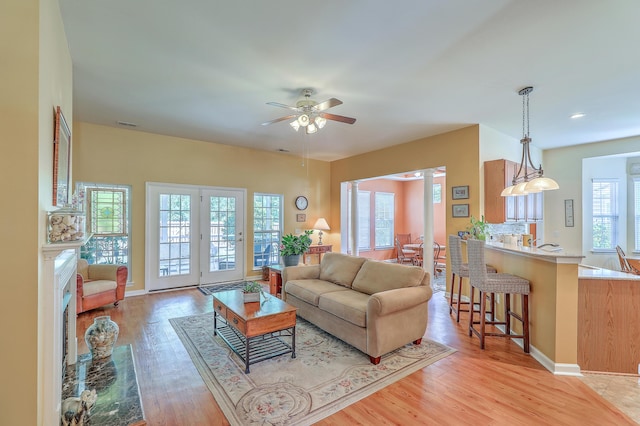 405 Decatur Dr, Summerville, SC 29486 - living room with light wood-style floors, a ceiling fan, and baseboards