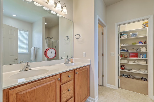 405 Decatur Dr, Summerville, SC 29486 - bathroom featuring double vanity, a sink, tile patterned floors, and a shower stall