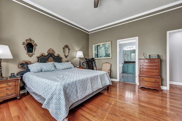 bedroom featuring light wood-type flooring, baseboards, ornamental molding, and a ceiling fan