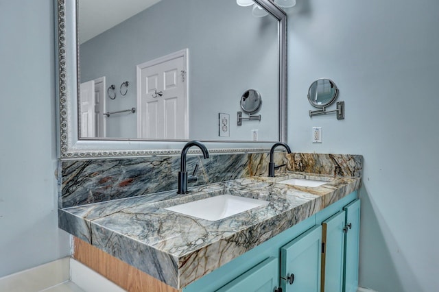 full bathroom featuring a sink and double vanity