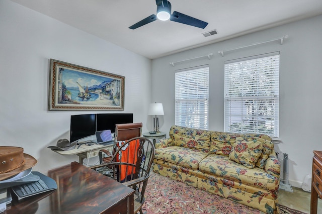 office featuring ceiling fan, visible vents, and baseboards