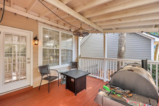 wooden deck with area for grilling