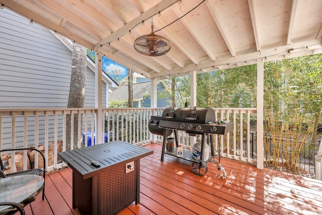 wooden terrace featuring area for grilling