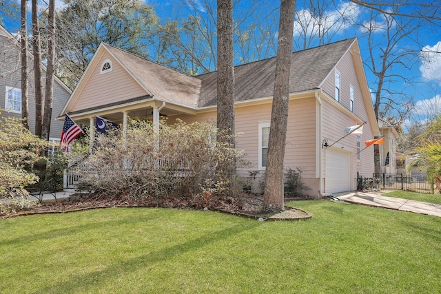 view of side of home with a garage, fence, driveway, a lawn, and roof with shingles