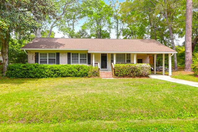 ranch-style house with a porch, brick siding, driveway, and a front lawn