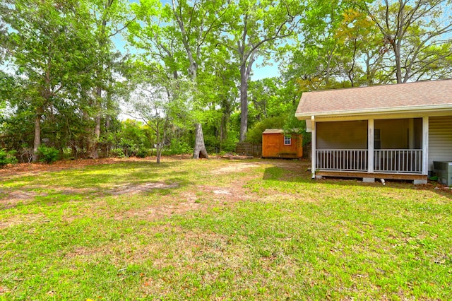 view of yard featuring a shed and an outdoor structure