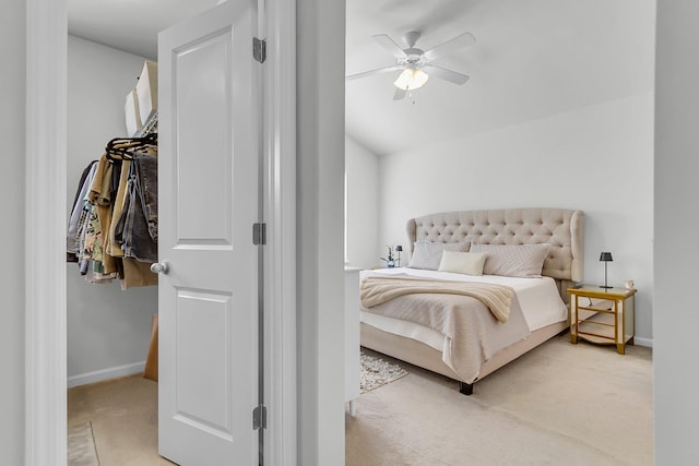 bedroom with light colored carpet and ceiling fan