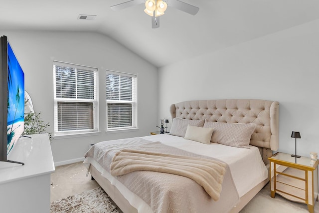 bedroom with lofted ceiling, light colored carpet, and ceiling fan