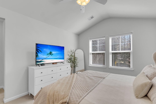 carpeted bedroom featuring vaulted ceiling and ceiling fan