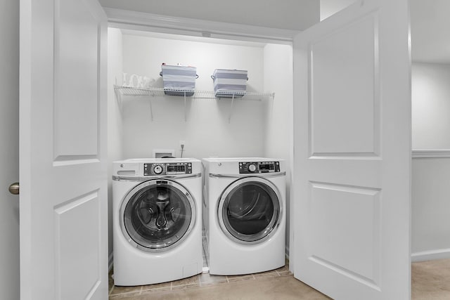 washroom featuring washer and clothes dryer