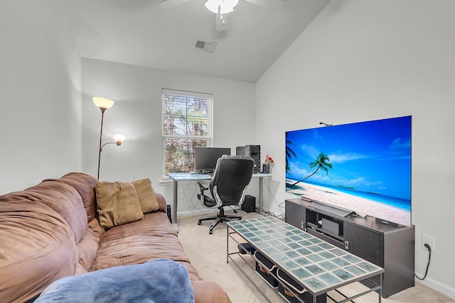 carpeted office space featuring ceiling fan and vaulted ceiling