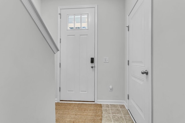 entryway with light tile patterned floors