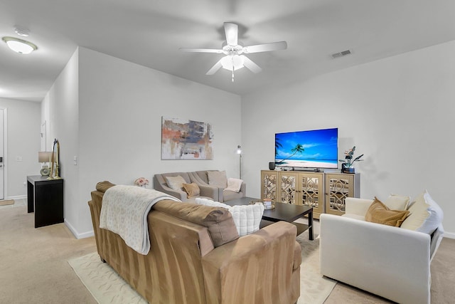 living room featuring light carpet and ceiling fan