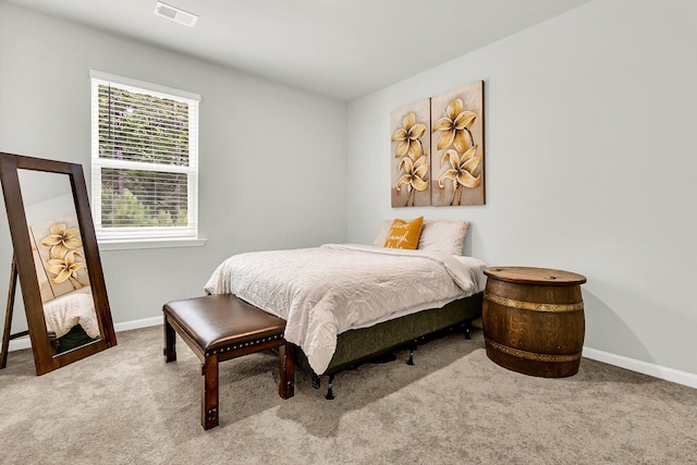 bedroom featuring light colored carpet