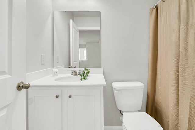 bathroom featuring vanity and toilet