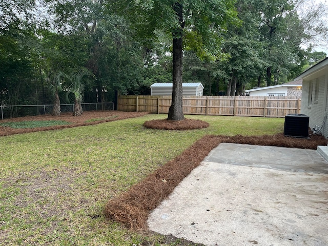 view of yard featuring cooling unit and a patio area