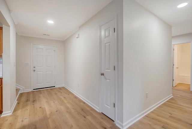 hallway with baseboards, recessed lighting, visible vents, and light wood-style floors