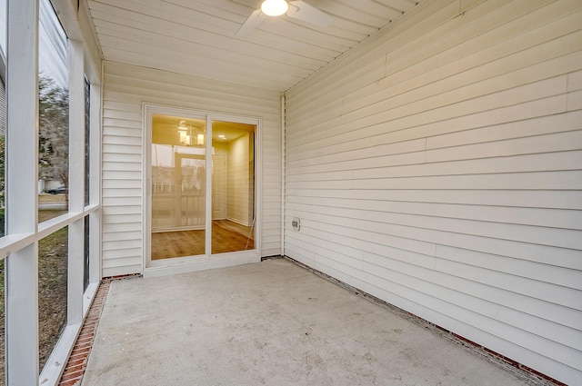 unfurnished sunroom featuring wood ceiling