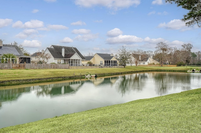 water view featuring fence and a residential view