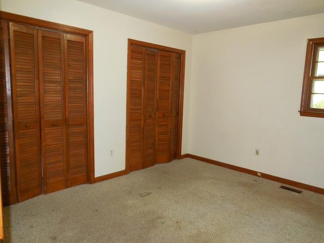 unfurnished bedroom featuring carpet