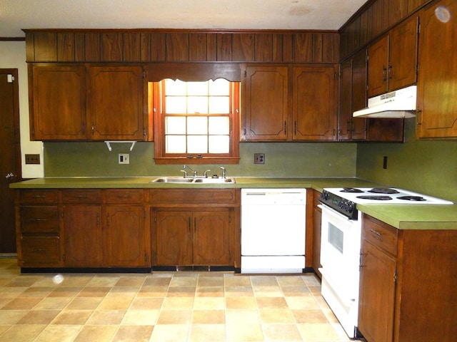 kitchen featuring white appliances and sink