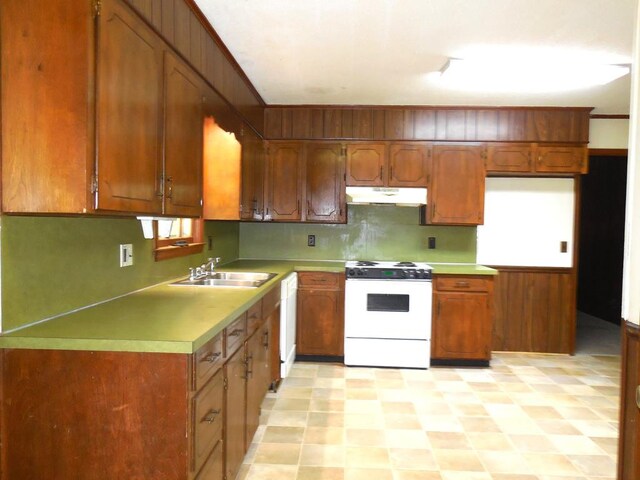 kitchen with sink and white appliances