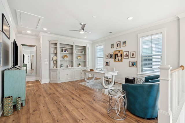 office featuring crown molding, ceiling fan, and light hardwood / wood-style floors