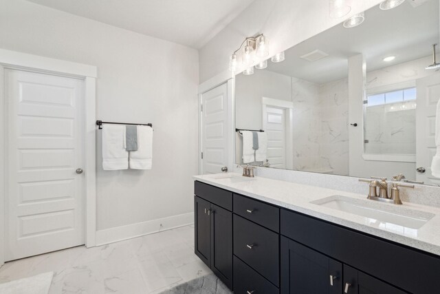 bathroom featuring vanity and tiled shower