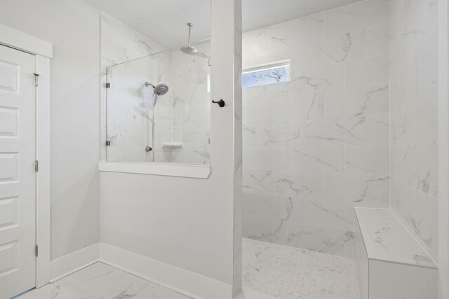 bathroom with a tile shower