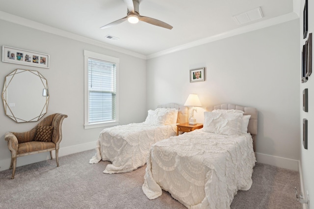 carpeted bedroom featuring ornamental molding and ceiling fan