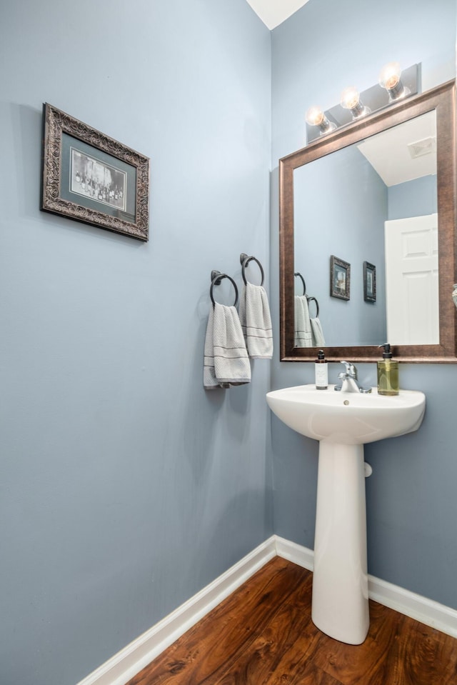 bathroom with wood-type flooring