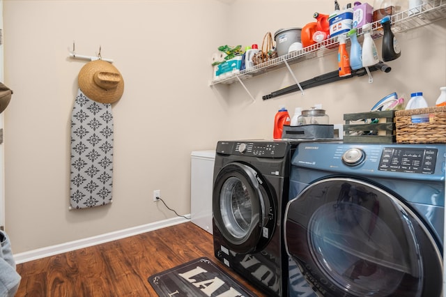 laundry room featuring dark hardwood / wood-style flooring and independent washer and dryer