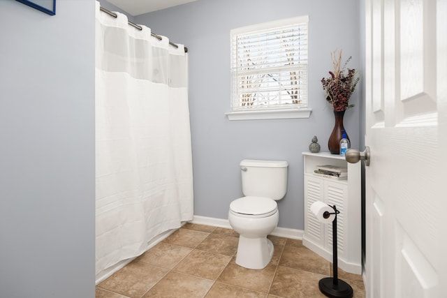 bathroom featuring tile patterned floors and toilet