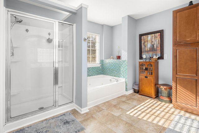 bathroom featuring separate shower and tub and tile patterned flooring