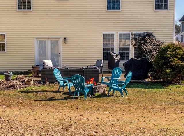 view of patio with area for grilling and an outdoor fire pit