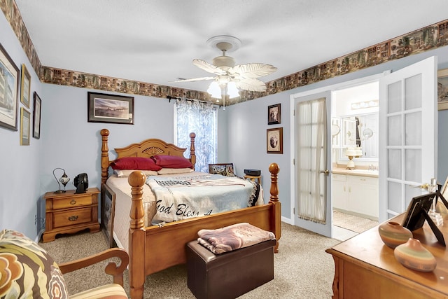 carpeted bedroom with multiple windows, ceiling fan, connected bathroom, and french doors