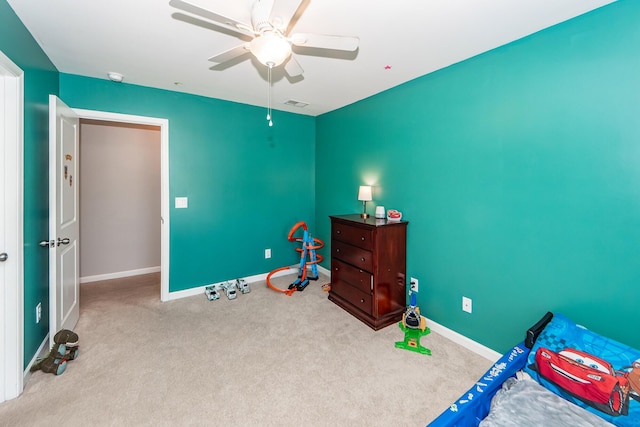 bedroom featuring ceiling fan and light colored carpet