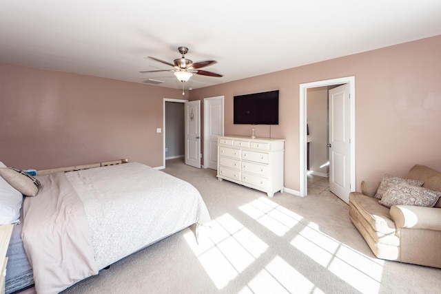 bedroom featuring ceiling fan and light colored carpet