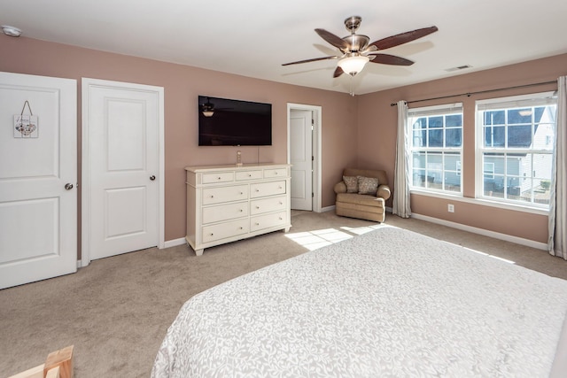 carpeted bedroom with ceiling fan