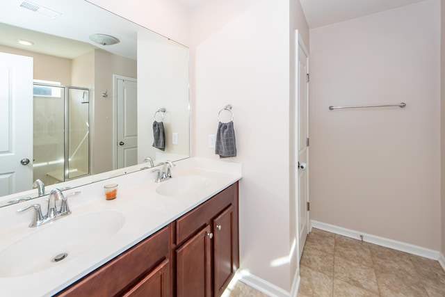 bathroom featuring walk in shower and vanity