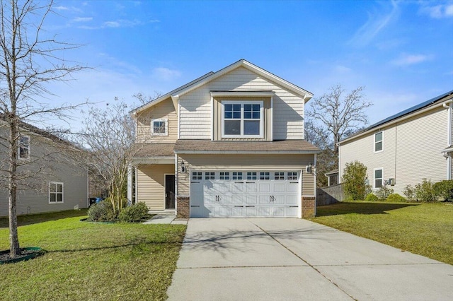 traditional-style home featuring brick siding, a front yard, driveway, and a garage