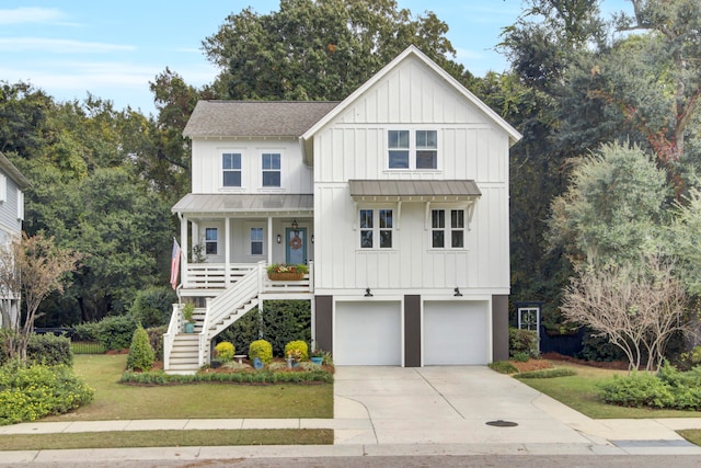 modern farmhouse style home featuring a front lawn, a porch, and a garage