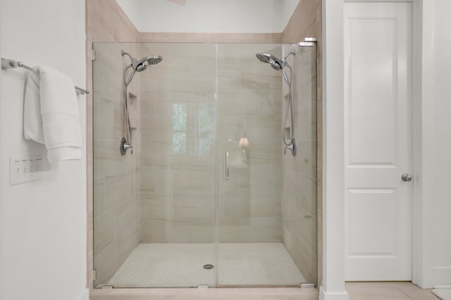 bathroom featuring tile patterned floors and walk in shower