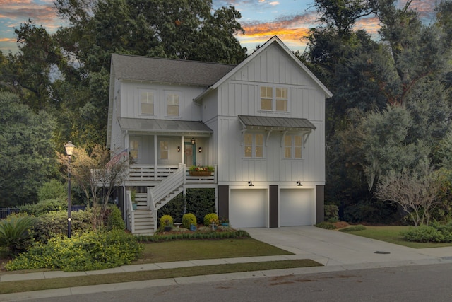 view of front of house featuring a porch and a garage